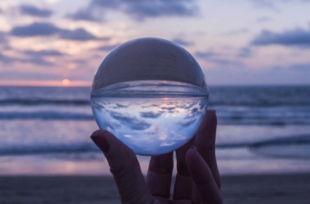 hand holding up a crystal ball to see future of Entrepreneurs Relief