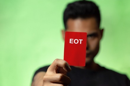 holding up a red card to signify disqualifying an EOT