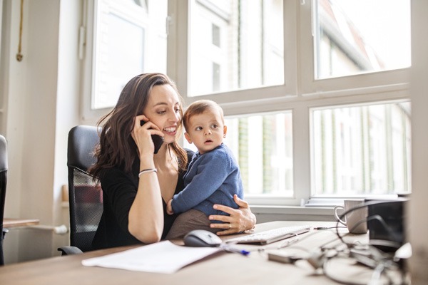 Woman with baby on the phone